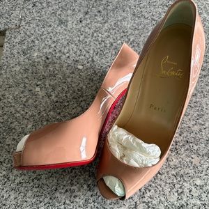 Christian Louboutin. Nude Patent Red Sole Pumps with peep toe.